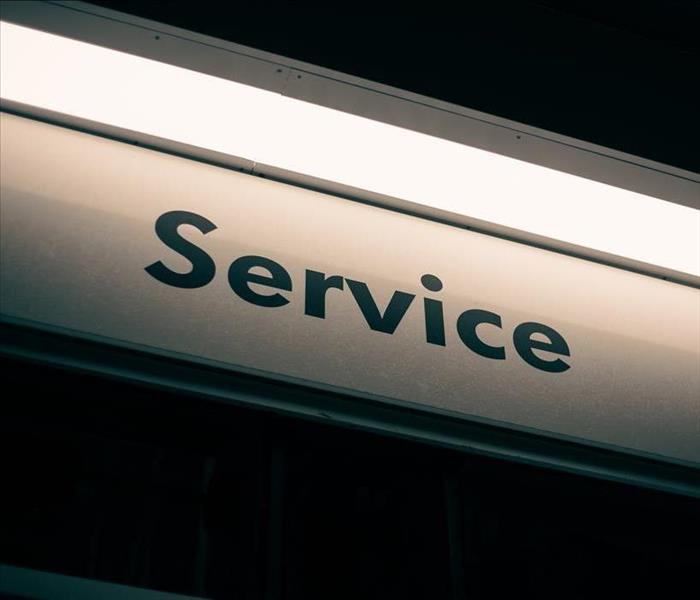 A sign that says service
